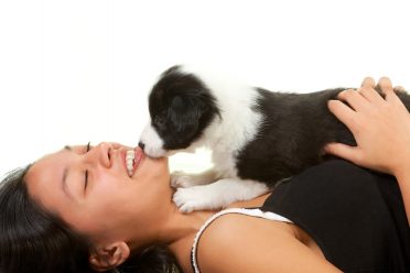 A picture of a happy girl who bought a Border Collie puppy